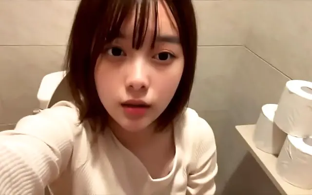 Japanese Amateur Sneaks Pleasure in Public Restroom Almost Exposed by Moans