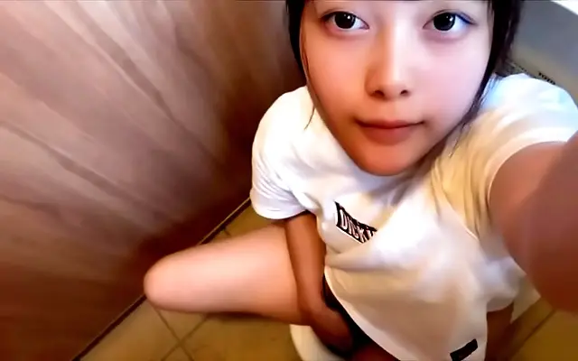 On all fours with her ass in the air she slowly fingers her dripping slit