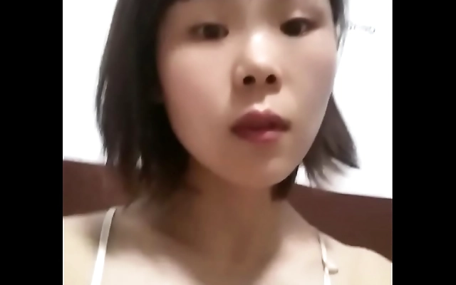 Close-up view of busty China wife teasing her big tits solo