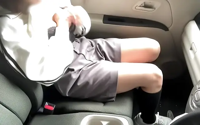 Intense Japanese teen moans loudly while pleasuring herself in a forest car