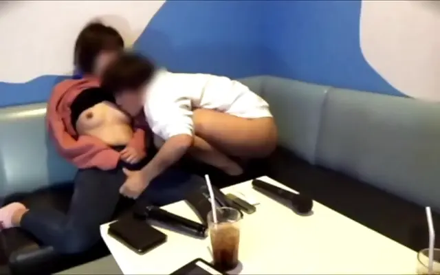 Two bodies heat up in a karaoke booth as passion takes control