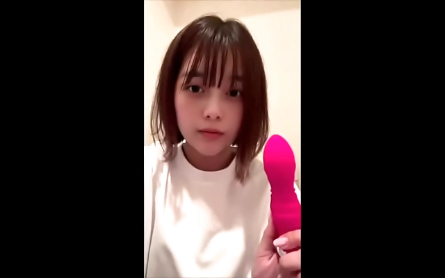 Rubbing through tight black skinnies with a toy until soaking wet